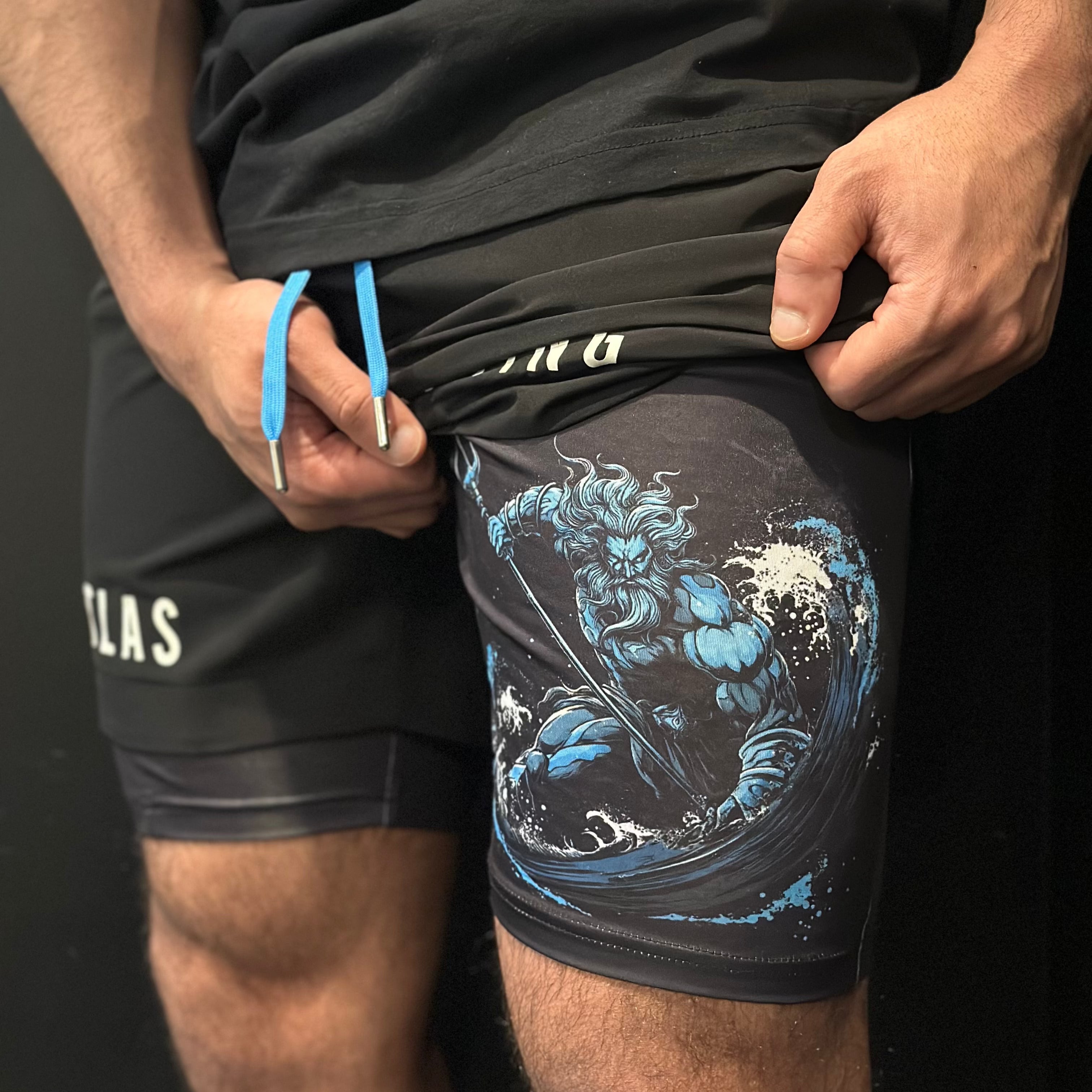 Atlas Lifting Co Poseidon performance shorts worn by athlete — moisture-wicking gym shorts